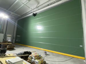 fabric helicopter hangar doors installation at Oulu Airport, Finland