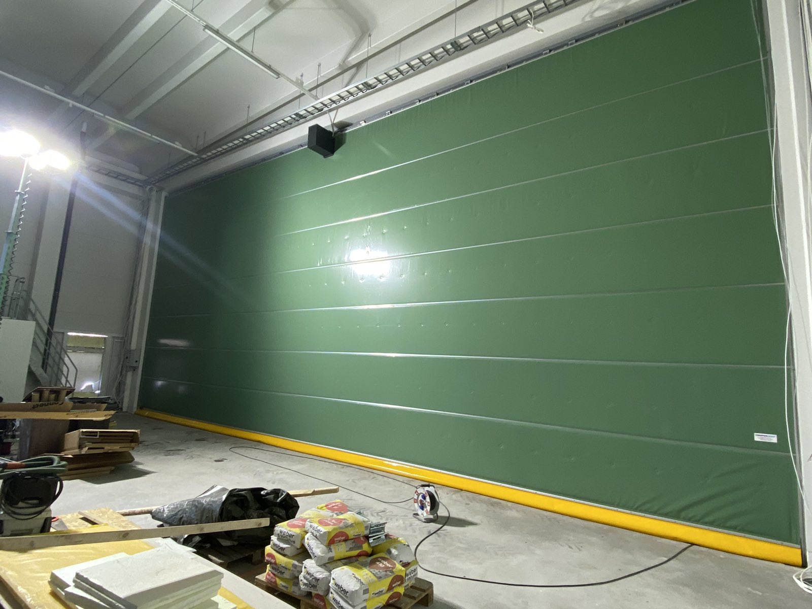 fabric helicopter hangar doors installation at Oulu Airport, Finland